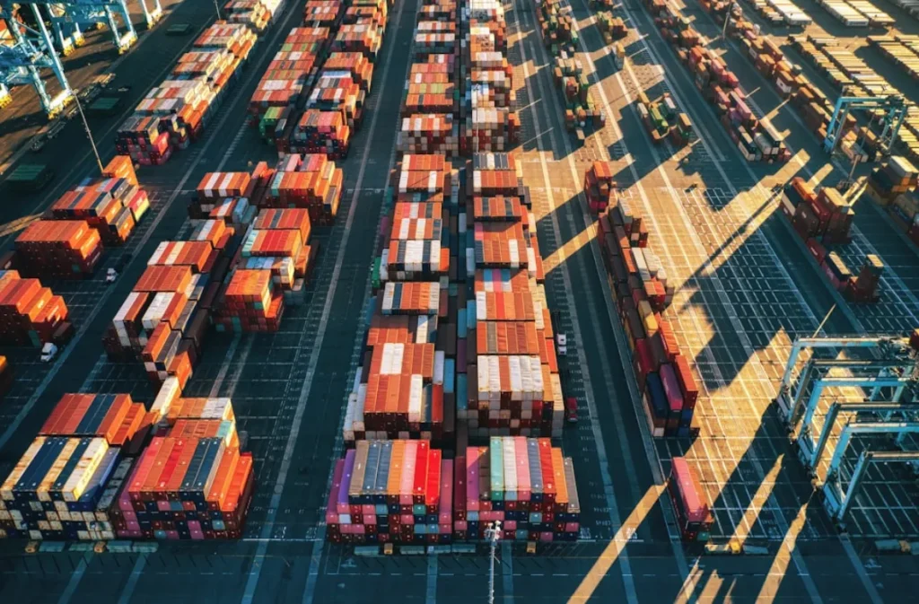 Shipping containers stacked at a hydrogen cargo terminal.