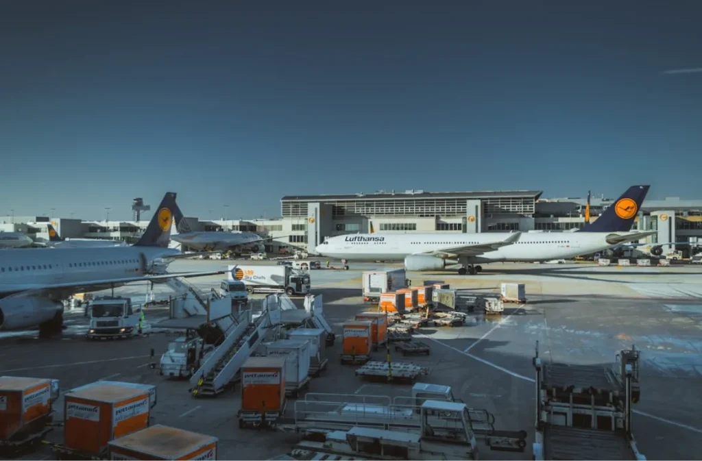 Lufthansa aircraft with cargo equipment on the tarmac.