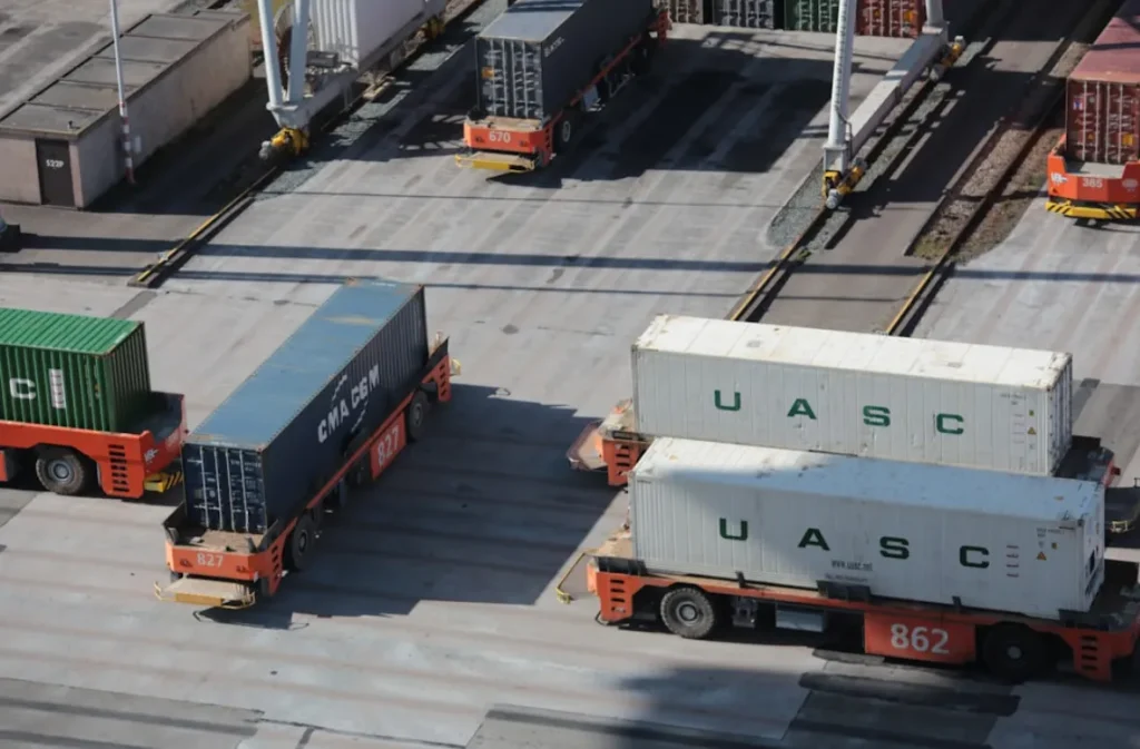 Automated cargo trucks transporting containers.