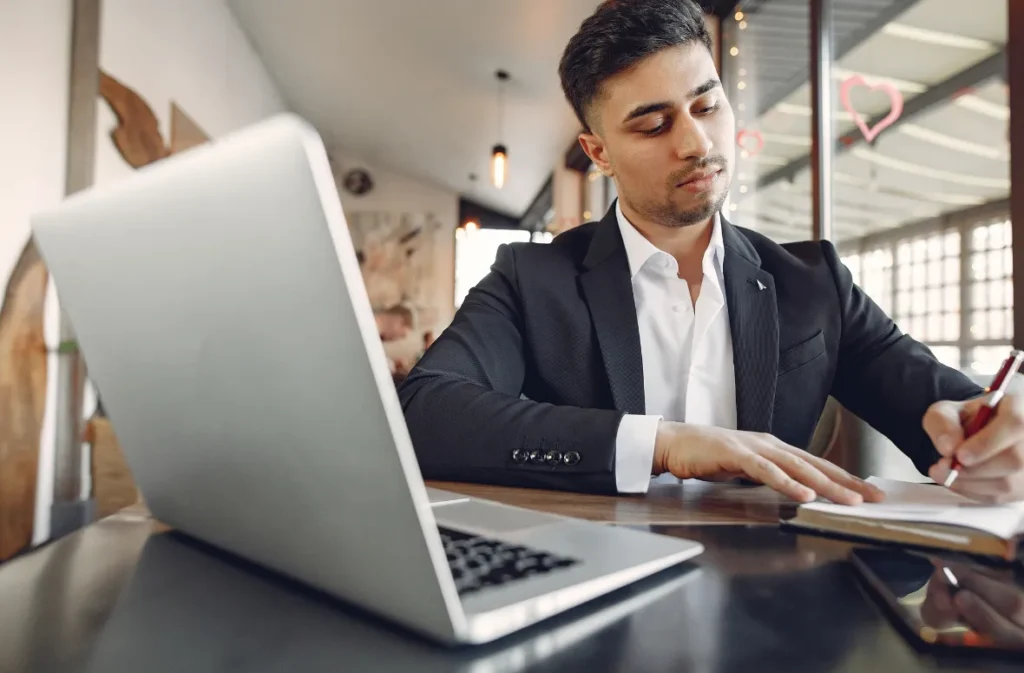 Account manager organizing logistics processes at a desk