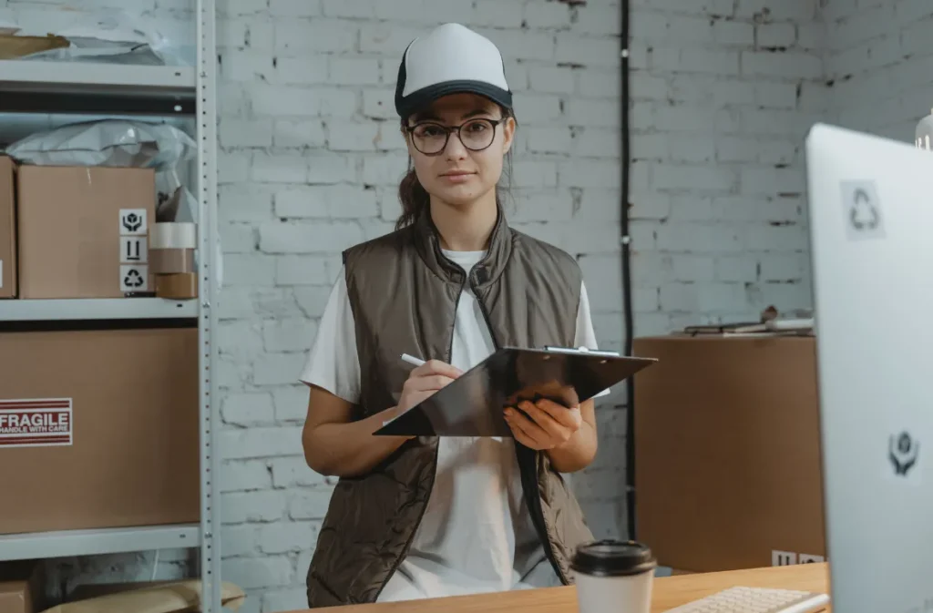 Shipping clerk managing inventory with a checklist