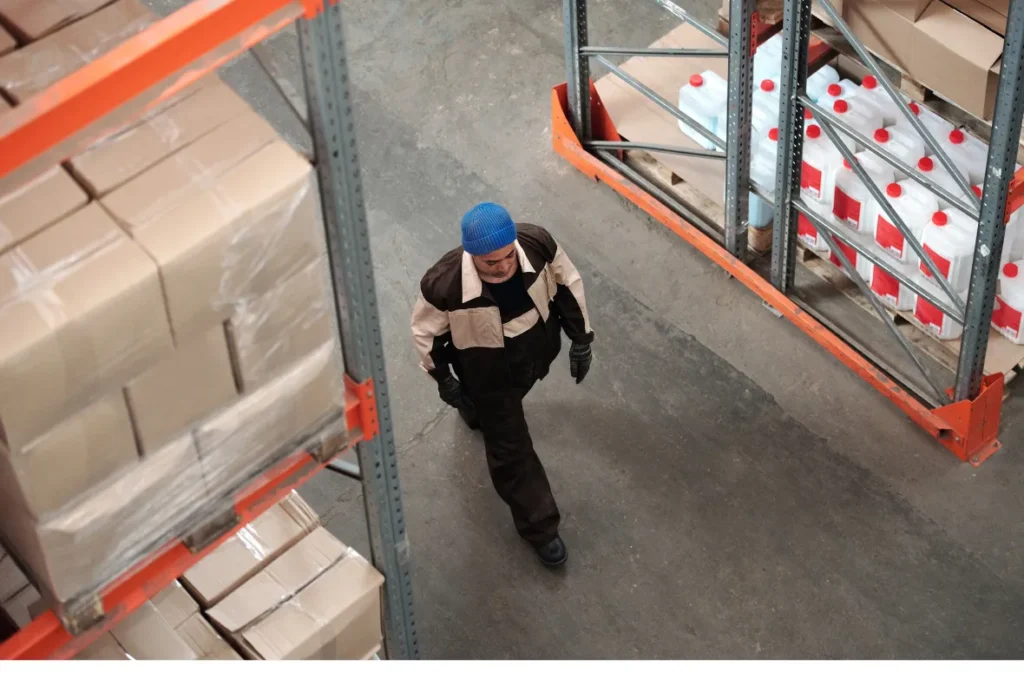 Warehouse worker navigating logistics and inventory tasks