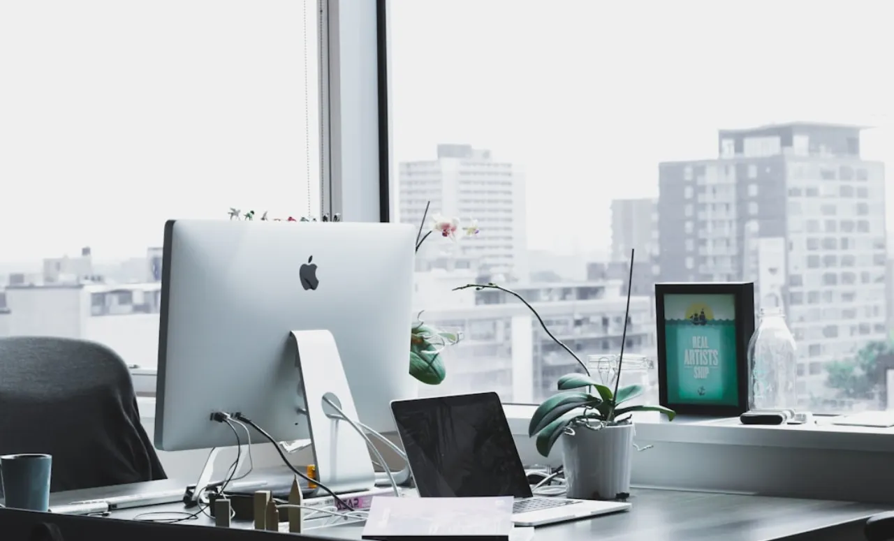 Office desk with devices for managing technology