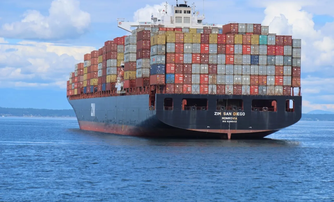 A cargo ship loaded with shipping containers in the port.