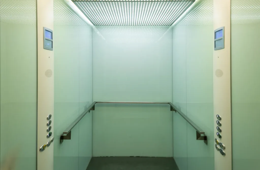 Minimalistic elevator space resembling modern container cabins.