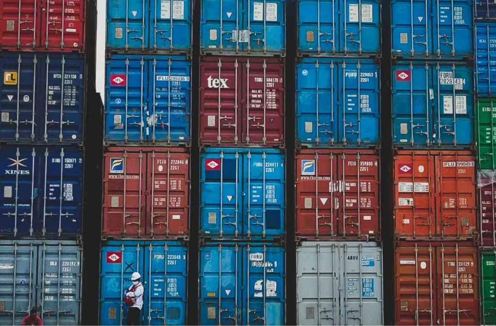 Stacked shipping containers with visible ventilation gaps.